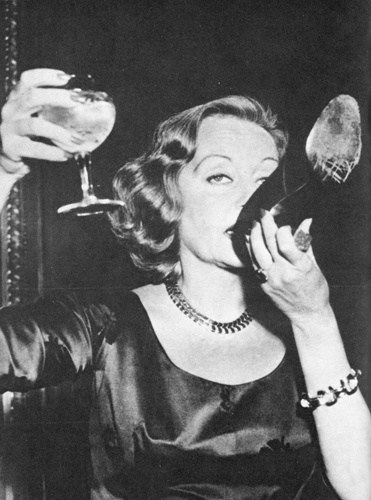 Tallula Bankhead drinking champagne out of her shoe at The Ritz, 1951